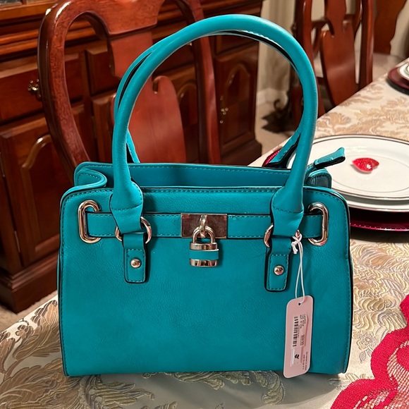 Charming Charlie Handbags - Charming Charlie Turquoise cross body purse